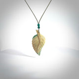 Hand carved blue Mammoth Tusk feather pendant with hand plaited adjustable cord. Woolly Mammoth tusk feather necklace. Hand carved by NZ Pacific. Art to Wear.