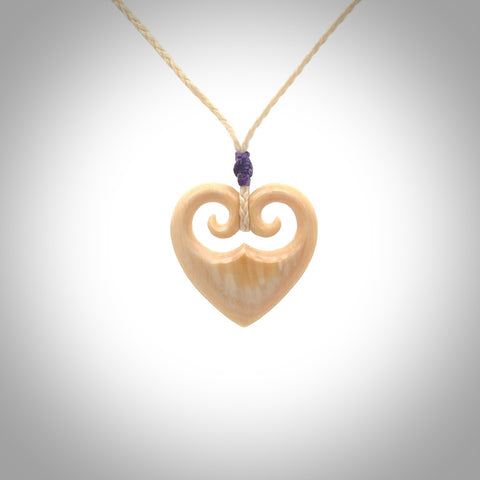 Hand carved heart pendant. Hand made from woolly mammoth tusk. Hand made jewellery for sale online. Rare and unique handmade jewellery. Made by NZ Pacific.