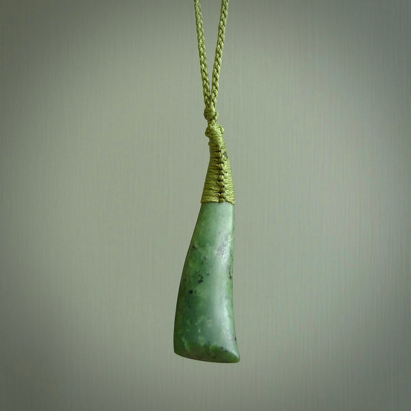 A lovely large sized New Zealand jade drop pendant. This piece is made from a light, mint green jade and is a wonderful light green colour. Carved by Ric Moor for NZ Pacific and delivered worldwide.