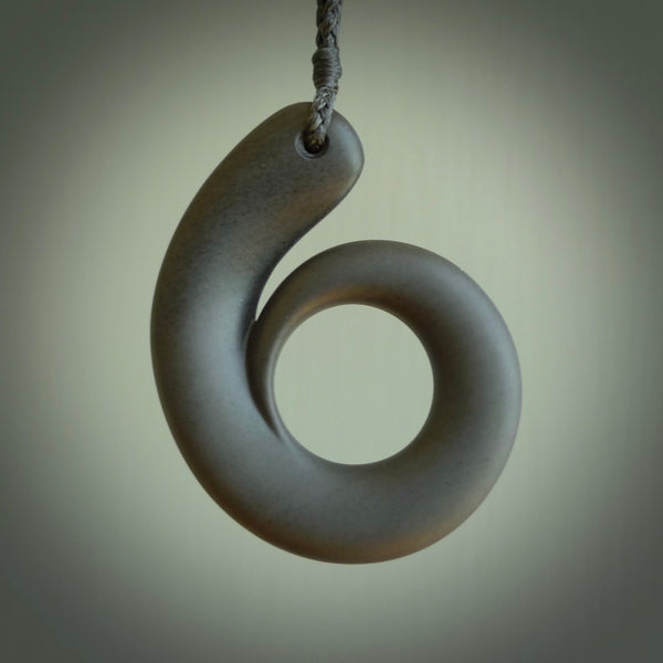 Argillite stone pendant shaped as a tusk. Hand carved by Rhys Hall for NZ Pacific. Handmade contemporary jewellery for sale online.