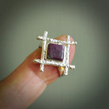 This is a handcrafted New Zealand Ruby, stone with sterling silver ring. This is a solid little work of art. We ship this worldwide for free and are happy to answer any questions that you may have about these or other products on our website. Hand made by Ana Krakosky and delivered in a woven kete pouch.