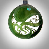 A hand carved New Zealand Jade and Sterling Silver Octopus pendant with Opal eye. Hand made by New Zealand artist Kerry Thompson.