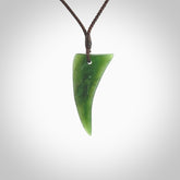 Hand carved pounamu drop pendant. Jade necklace hand made in New Zealand. A contemporary drop pendant carved from rare New Zealand jade. NZ Pacific jade jewellery for sale online.