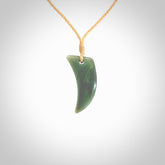 Hand carved pounamu drop pendant. Jade necklace hand made in New Zealand. A contemporary drop pendant carved from rare New Zealand Inanga jade. NZ Pacific jade jewellery for sale online.