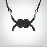 A gorgeous hand carved black jade reef knot pendant with sterling silver. Hand made in Black Jade with Sterling Silver and provided with adjustable cord.