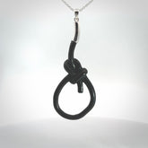 A gorgeous hand carved black jade bowline knot pendant with sterling silver. Hand made in Black Jade with Sterling Silver and provided with sterling silver chain.