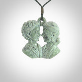 Hand carved New Zealand Kokopu jade contemporary couple face pendant. Hand made for you by NZ Pacific. Hand carved jewellery made from real New Zealand jade and for sale online. One only pendant with adjustable green cord.