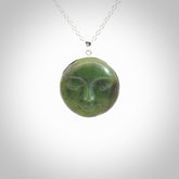 Hand made New Zealand Jade moon face necklace with Sterling Silver. Made by NZ Pacific and sale online only. Delivered with sterling silver chain and packaged in a woven kete pouch.