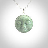 Hand made New Zealand Jade moon face necklace with Sterling Silver. Made by NZ Pacific and sale online only. Delivered with sterling silver chain and packaged in a woven kete pouch.