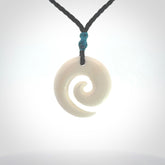 Hand carved natural bone koru pendant. Made by NZ Pacific.