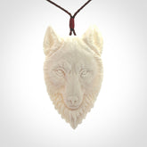 Hand carved bone wolf pendant.
