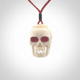 These are handmade skull pendants carved from deer antler with Synthetic Ruby Red Corundum. A fantastic piece if you like skulls and would like a medium sized piece. The cord is adjustable so you can wear this where it suits you best. We ship these free worldwide.