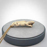 Hand carved deer antler Tuatara pendant.