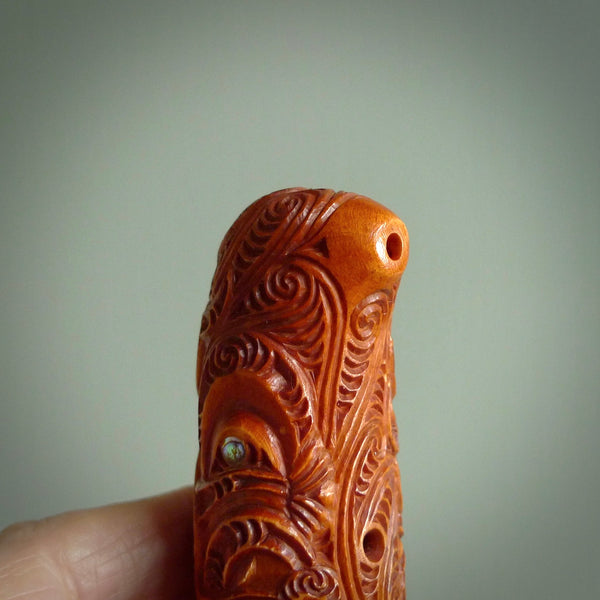 A traditional hand carved Māori Kōauau flute. This piece is made from bone and is a fully functioning musical instrument and can be played. Beautiful ethnic art hand made by NZ Pacific.
