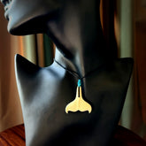 Hand carved bone whale tail pendant. Unisex necklace hand carved by Andrew Doughty here in New Zealand. Unique art to wear. Delivered with an adjustable black cord.