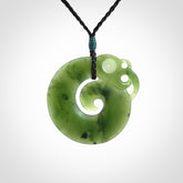 New Zealand Koru Manaia. Hand carved koropepe pendant. Made in New Zealand. Real Jade, pounamu.