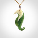 Hand carved jade and bone bird pendant