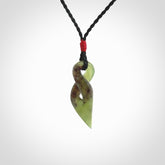 A Fine Twist Pendant, Carved in Totoweka Jade