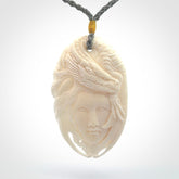 Hand carved bone dragon woman pendant