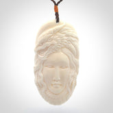Hand carved bone dragon woman pendant