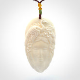 Hand Carved Woman with Peacock Pendant