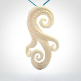 This is a beautiful hand carved octopus tentacle pendant. It is a wonderfully detailed pendant that we have carved in natural, untreated bone. We provide this with a paradise blue coloured adjustable cord and shipping is included worldwide.