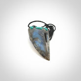This picture shows a Labradorite stone drop pendant that we have hand carved.