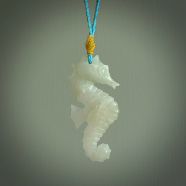 A hand carved Jadeite seahorse pendant. We have carved this from beautiful jadeite and we bind them with our hand-plaited cords. The cords are a waxed polyester so they are durable and strong. We ship these worldwide with express courier anywhere in the world.