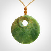 Hand carved New Zealand Flower Jade disc pendant