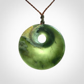 Hand carved New Zealand Jade disc pendant