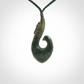 Hand carved New Zealand Jade hook pendant