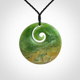 Hand carved New Zealand Flower Jade koru pendant