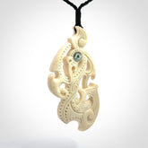 This is a wonderful, finely carved Manaia pendant. It is hand carved by Andrew Doughty and we will ship it to you free anywhere in the world. Hand made from whale bone and delivered to you with an adjustable black cord. Packaged in a woven kete pouch.