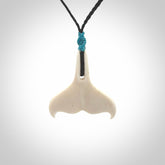 Hand carved bone whale tail pendant. Unisex necklace hand carved by Andrew Doughty here in New Zealand. Unique art to wear. Delivered with an adjustable black cord.