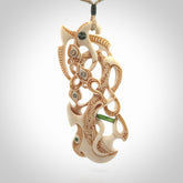 Hand carved bone manaia pendant. This is a complex carving by New Zealand carver and artist, Andrew Doughty. It is an intricate representation of a manaia carved to represent protection. It can be worn but is also a quality that warrants display.