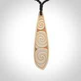 This is a wonderful, finely carved bone drop pendant.