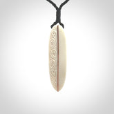 This is a wonderful, finely carved drop pendant. Hand made from bone with copper inlay and delivered to you with an adjustable black cord.
