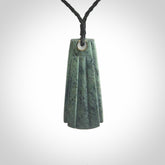 This is a wonderful New Zealand Jade Toki drop pendant.