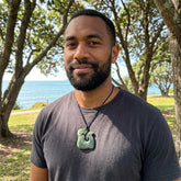 Man wearing jade pendant