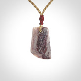 Hand carved Aroha stone toki pendant