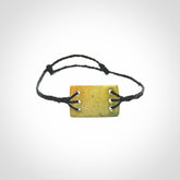 Hand carved New Zealand flower jade adjustable bracelet with black cord. One only armband for women and men.