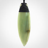 This picture shows a beautiful large sized drop pendant carved in New Zealand Jade, pounamu. It is a lovely semi-translucent green colour, which is glows when held to the light. A gorgeous and very meaningful pendant with an adjustable cord.