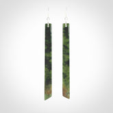 These are stunning large sized drop flower jade earrings carved in New Zealand. It is carved from a beautiful green piece of New Zealand Flower Jade and with Sterling Silver hooks and findings.