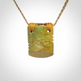 Hand carved New Zealand Flower Jade drop pendant.