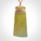This is a lovely notched toki pendant made from a gorgeous New Zealand Flower Jade.