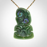 This is a medium sized tiki - carved from gorgeous New Zealand jade. The cord is an adjustable four plaited cord in tan and khaki.