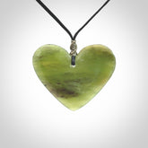 A hand carved heart pendant made from New Zealand jade.