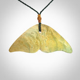 Hand carved New Zealand Jade whale tail pendant.