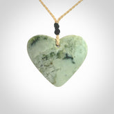 A hand carved heart pendant made from New Zealand jade.