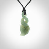 Hand carved small sized, New Zealand Inanga jade double twist pendant.